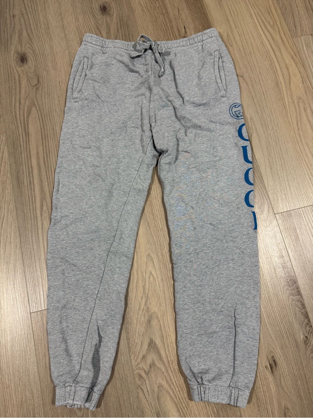 Gucci Gray Sweatpants with Blue Logo Print